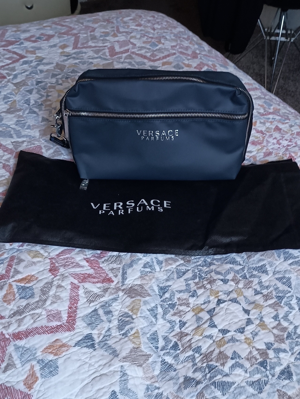 Versace Parfums toiletry pouch often included as a gift with perfume purchases.